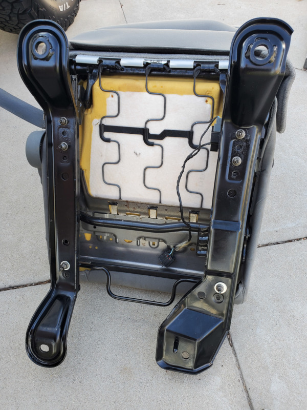 Stock JK driver seat brackets mounted one inch farther back on the brackets.